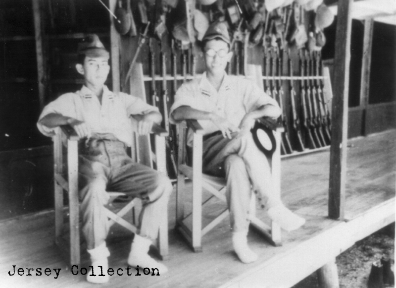 Officer members of the Tarawa Garrison. Notice the arms and equipment in the background ready for immediate use